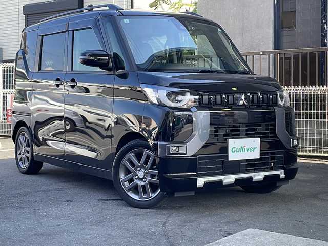 三菱 デリカミニ T プレミアム 京都府 2024(令6)年 1.8万km アメジストブラック SDナビ/（ケンウッド　MDV-D7098TW）/CD/DVD再生機能有/Bluetooth/マイパイロット/e-Assist/マルチアラウンドビューモニター/ステアリングヒーター/LEDヘッドライト/デジタルインナーミラー/ハーフレザーシート/両側自動スライドドア/禁煙車/シートヒーター/パドルシフト/キーレスオペレーション/プッシュスタート/ドライブレコーダー（前のみ）/　（DC-DR413）/ダウンヒルコントロール/フロアマット/ETC/レンタカー登録/保証書/取扱説明書