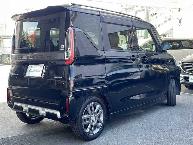 三菱 デリカミニ T プレミアム 京都府 2024(令6)年 1.8万km アメジストブラック SDナビ/（ケンウッド　MDV-D7098TW）/CD/DVD再生機能有/Bluetooth/マイパイロット/e-Assist/マルチアラウンドビューモニター/ステアリングヒーター/LEDヘッドライト/デジタルインナーミラー/ハーフレザーシート/両側自動スライドドア/禁煙車/シートヒーター/パドルシフト/キーレスオペレーション/プッシュスタート/ドライブレコーダー（前のみ）/　（DC-DR413）/ダウンヒルコントロール/フロアマット/ETC/レンタカー登録/保証書/取扱説明書