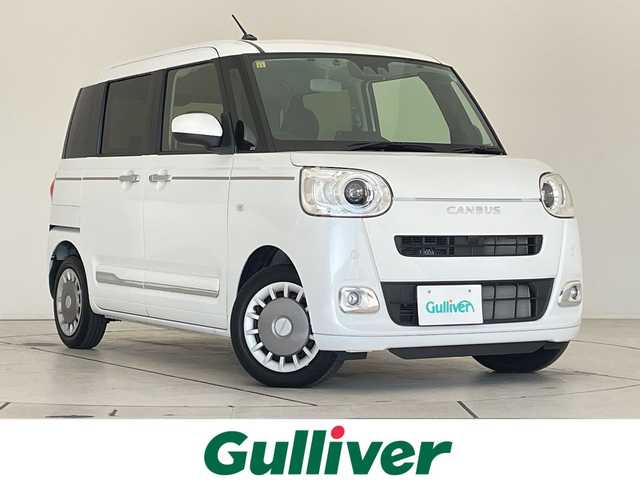 ダイハツ ムーヴ キャンバス セオリー G 愛知県 2023(令5)年 1.6万km パールホワイトⅢ スマートアシストIII/SDナビ　SDカードなし/ホットカップホルダー/シートヒーター/LEDヘッドライト/両側パワースライドドア/オートマチックハイビーム/レーンキープアシスト/衝突軽減システム/フルセグ/CD DVD/Bluetooth/ステアリングスイッチ/スマートキー/プッシュスタート