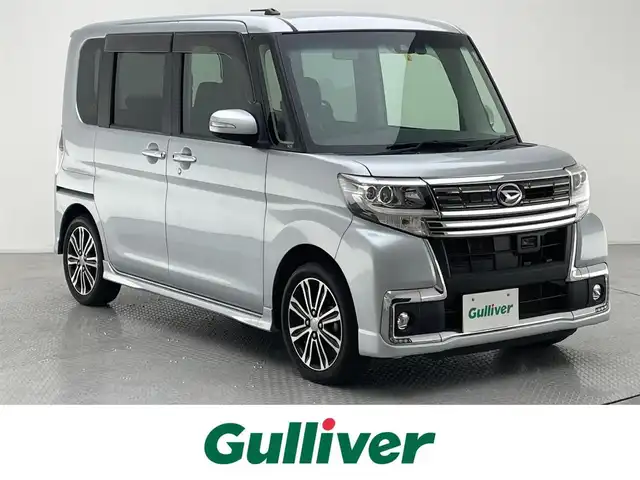 ダイハツ タント カスタム RS トップED SAⅡ 兵庫県 2016(平28)年 7.7万km ブライトシルバーメタリック 外部検査実施済み/ワンオーナー/ターボ/純正SDナビ【NSZN-X66D-T3】/(DVD/フルセグTV/Bluetooth/USB/MSV)/フリップダウンモニター/TVキャンセラー/バックカメラ/ハーフレザーシート/両側パワースライドドア/スマートアシスト２/・衝突回避支援ブレーキ機能/・衝突警報機能/・車線逸脱警報機能/・誤発進抑制制御機能/・先行車発進お知らせ機能/スマートキー/LEDヘッドライト/前方ドライブレコーダー/ETC/横滑り防止機能/純正15インチアルミホイール/保証書/取扱説明書