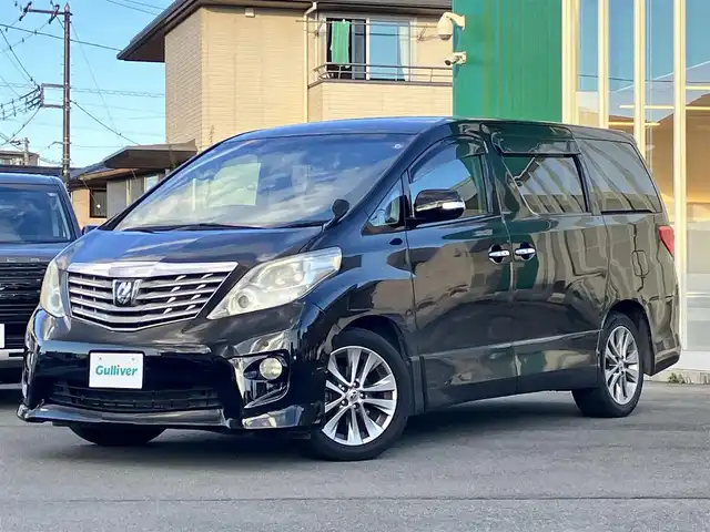 トヨタ アルファード 240S プライムセレクションⅡ 静岡県 2010(平22)年 9.5万km ブラック エンジンスタートボタン/パワーステアリング/パワーウィンドウ/スマートキー/Wオートエアコン/ALPINE製後席モニター/ETC/バックカメラ/SDナビ（CD/DVD/BT/フルセグ）/三列シート/オットマン/電動リアゲート/ウォークスルー/純正フロアマット/純正アルミホイール/両側パワースライドドア/布シート/ABS/横滑り防止装置/コーナーセンサー前後/オートライト/W+サイドエアバッグ/カーテンエアバッグ