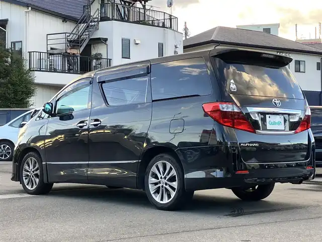 トヨタ アルファード 240S プライムセレクションⅡ 静岡県 2010(平22)年 9.5万km ブラック エンジンスタートボタン/パワーステアリング/パワーウィンドウ/スマートキー/Wオートエアコン/ALPINE製後席モニター/ETC/バックカメラ/SDナビ（CD/DVD/BT/フルセグ）/三列シート/オットマン/電動リアゲート/ウォークスルー/純正フロアマット/純正アルミホイール/両側パワースライドドア/布シート/ABS/横滑り防止装置/コーナーセンサー前後/オートライト/W+サイドエアバッグ/カーテンエアバッグ