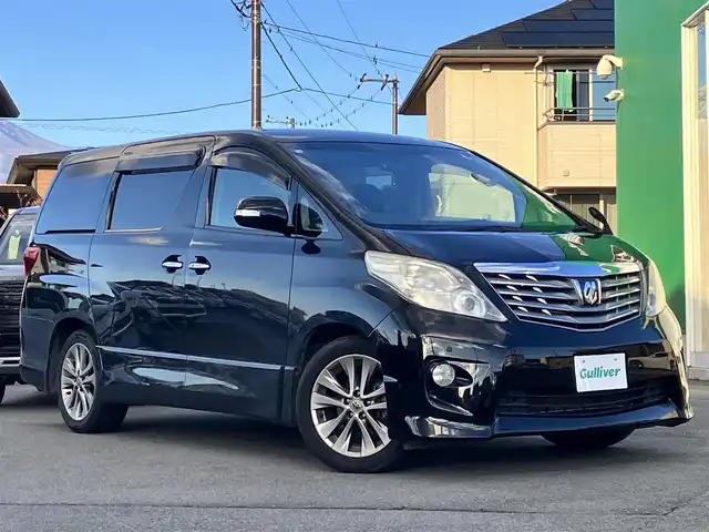 トヨタ アルファード 240S プライムセレクションⅡ 静岡県 2010(平22)年 9.5万km ブラック エンジンスタートボタン/パワーステアリング/パワーウィンドウ/スマートキー/Wオートエアコン/ALPINE製後席モニター/ETC/バックカメラ/SDナビ（CD/DVD/BT/フルセグ）/三列シート/オットマン/電動リアゲート/ウォークスルー/純正フロアマット/純正アルミホイール/両側パワースライドドア/布シート/ABS/横滑り防止装置/コーナーセンサー前後/オートライト/W+サイドエアバッグ/カーテンエアバッグ