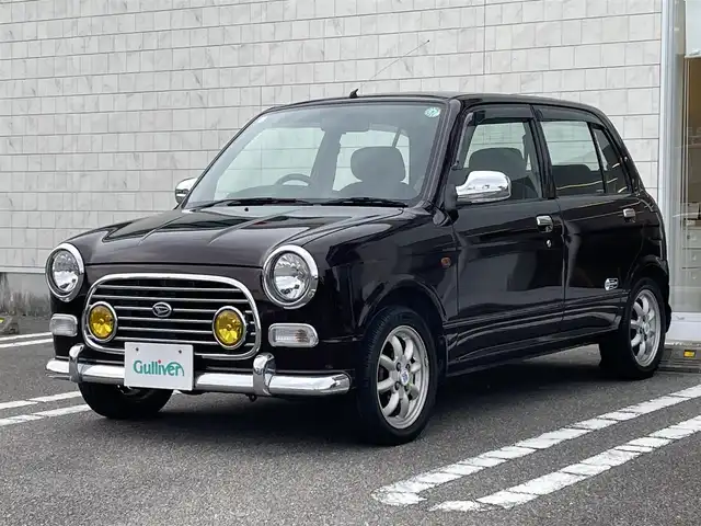 ダイハツ ミラ ジーノ ミニライトスペシャル 宮崎県 2001(平13)年 11.4万km ワインレッドマイカ 同色全塗装【R30ワインレッドマイカ】/2WAY BASS-REFLEX SPEAKER/社外オーディオ【clarion製】/・CD・ラジオ・USB/純正フロアマット/パワーウィンドウ【D席オート】/純正14インチアルミホイール/スペアキー有り