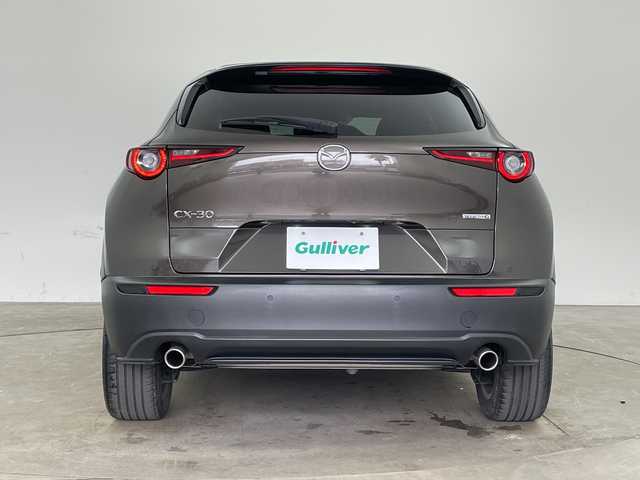 マツダ ＣＸ－３０ 20S Lパッケージ 兵庫県 2020(令2)年 2.1万km チタニウムフラッシュマイカ ・i-ACTIVSENSE/・スマートブレーキサポート/・スマートブレーキサポート（後進時）/・車間制御/・レーダークルーズコントロール/・オートマチックハイビーム/・速度標識警報/・ドライバーモニタリング/・前側方接近車両検知/・後側方接近車両検知/・車線逸脱警報システム/・ブラインドスポットモニター/・レーンキープアシストシステム/・前後パーキングセンサー/・純正8.8型SDナビ＆TV＆BT＆USB＆DVD/・360°カメラ/・黒革シート/・前席パワーシート/・前席シートヒーター/・運転席メモリーシート/・アイドリングストップ/・横滑り防止装置/・パワーバックドア/・革巻きステアリング/・ステアリングスイッチ/・ステアリングヒーター/・純正フロアマット/・電子パーキング/・オートホールド/・スマートキー/・プッシュスタート/・ビルトインETC/・電動格納ミラー/・LEDヘッドライト/・オートライト/・純正18インチアルミホイール