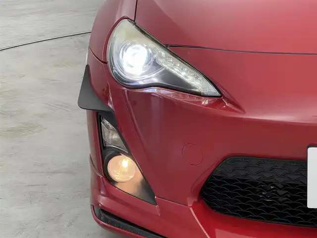 トヨタ ８６ GT 福岡県 2014(平26)年 7.2万km ライトニングレッド モデリスタエアロ　/社外ナビ（Ｂｌｕｅｔｏｏｔｈ，フルセグＴＶ）　/バックカメラ　/ＥＴＣ　/横滑り防止　/プッシュスタート　/スマートキー　/純正フロアマット　/オートライト　/社外１８インチアルミホイール　/６ＭＴ/GReddy車高調/TOM`ｓリアテールランプ