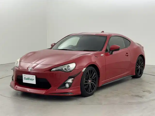 トヨタ ８６ GT 福岡県 2014(平26)年 7.2万km ライトニングレッド モデリスタエアロ　/社外ナビ（Ｂｌｕｅｔｏｏｔｈ，フルセグＴＶ）　/バックカメラ　/ＥＴＣ　/横滑り防止　/プッシュスタート　/スマートキー　/純正フロアマット　/オートライト　/社外１８インチアルミホイール　/６ＭＴ/GReddy車高調/TOM`ｓリアテールランプ