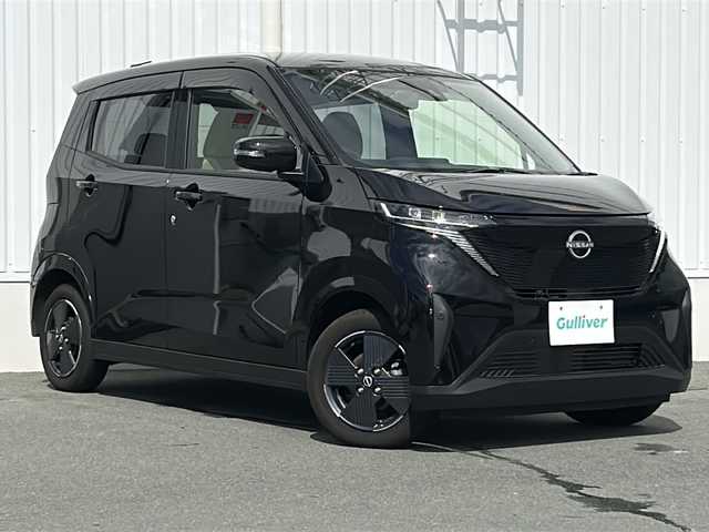 日産 サクラ X 三重県 2023(令5)年 1.2万km ブラック 純正ディスプレイオーディオ /全周囲カメラ /スペアキー /360°セーフティアシスト /レーンディパーチャーウォーニング /USB給電ポート/純正フロアマット /LEDヘッドライト /オートライト /電動格納ミラー /禁煙車
