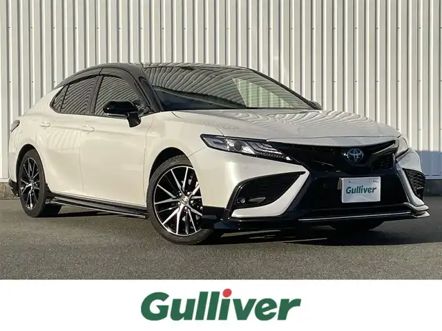 トヨタ カムリ WSレザーパッケージ 福岡県 2023(令5)年 4.5万km アティチュードブラックマイカ/プラチナホワイトパールマイカ パノラマルーフ/ＧＲエアロ(F.S.R)/ＪＢＬサウンド/純正９インチＤＡナビ/フルセグ/BT/AM/FM/Miracast/applecarplay/androidauto/トヨタセーフティセンス/PCS/LDA/RCTA/クリアランスソナー/PKSB/黒革シート/バックカメラ/D/Nシートヒーター/D/Nパワーシート/ＢＳＭ/ＨＵＤ/パドルシフト/革巻ステアリング/純正アルミ/レーダークルーズコントロール/LEDオートライト/オートハイビーム/フォグランプ/ワイヤレス充電/ステアリングスイッチ/テレビキャンセラー/電動パーキング/ブレーキホールド/ビルトインETC2.0/スマートキー/プッシュスタート/電格ミラー/ドアバイザー/AC100V