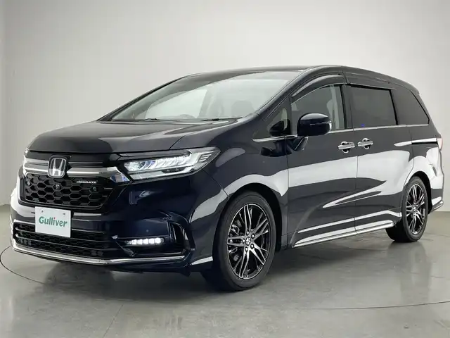 ホンダ オデッセイ ハイブリッド e:HEVアブソルート EX 愛知県 2022(令4)年 7.6万km プレミアムヴィーナスブラックP 純正１０型ナビ　フルセグＴＶ　ＨＤＭＩ　ＵＳＢ　純正１２．８型後席モニター　全方位カメラ　ナビ連動前後ドラレコ　パーキングアシスト　ホンダセンシング　衝突軽減装置　追従クルコン　シートヒーター LEDオートライト　オットマン　コーナーセンサー　BSM　カープレイ対応ナビ　TVキャンセラー　禁煙車