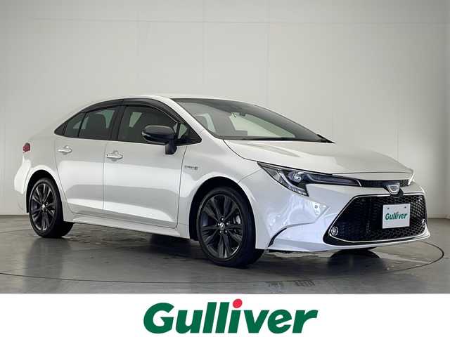トヨタ カローラ ハイブリット ダブルバイビー 宮崎県 2020(令2)年 2.4万km ホワイトパールクリスタルシャイン Toyota Safety Sense/〇プリクラシュセーフティ/〇レーントレーシングアシスト/〇ブラインドスポットモニター/〇リアクロストラフィックアラート/〇クリアランスソナー/〇パーキングサポートブレーキ/〇ロードサインアシスト/〇レーダークルーズコントロール/〇オートマチックハイビーム/〇先行車発進告知/スペアタイヤ/純正9インチディスプレイオーディオ/フルセグTV/バックカメラ/ハーフレザーシート/シートヒーター/ステアリングヒーター/LEDヘッドライト/純正17インチＡＷ/スマートキー×2