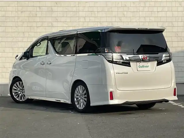 トヨタ ヴェルファイア Z Aエディション 愛知県 2015(平27)年 8.2万km ホワイトパールクリスタルシャイン TEIN車高調/モデリスタフロントグリル/ETC/USB/HDMI接続/クルーズコントロール/両側パワースライドドア/ツインムーンルーフ/純正フロアマット/ウォークスルー（2列目）/オットマン（N、2列目）/純正18インチアルミホイール/LEDヘッドライト/コーナーセンサー/横滑り防止装置/衝突軽減ブレーキ/MTモード付きAT/AC100V/全席オートエアコン/スマートキー/プッシュスタート
