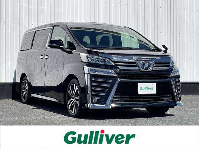 トヨタ ヴェルファイア Z Gエディション 千葉県 2020(令2)年 2.1万km ブラック 社外9インチナビ/(CD/DVD/BT/HDMI/フルセグTV)/社外フリップダウンモニター/バックカメラ/衝突被害軽減システム/車線逸脱警報/レーダークルーズコントロール/サンルーフ/レザーシート/両側パワースライドドア/電動リアゲート/横滑り防止装置/ETC/ドライブレコーダー/LEDヘッドライト/フォグランプ/オートライト/ウィンカーミラー/電動格納ミラー/ブラインドスポットモニター/純正17インチAW/シートヒーター/エアシート/パワーシート/運転席メモリーシート/ステアリングヒーター/AC100V/プッシュスタート/スマートキー/フロアマット/取扱説明書/保証書/スペアキー