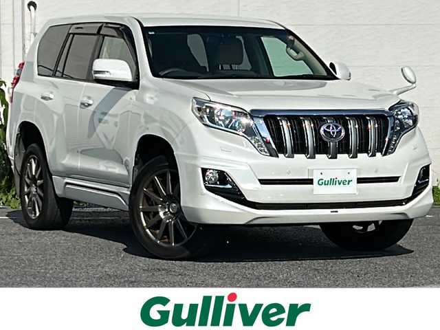 トヨタ ランドクルーザー プラド TX Lパッケージ 千葉県 2017(平29)年 7.6万km ホワイトパールクリスタルシャイン モデリスタエアロ　モデリスタウィングデッキ　モデリスタマフラー　２０ＡＷ　ベージュ革シート　ナビＮＳＺＴ－Ｗ６６Ｔ　バックカメラ　シートヒーター　電動シート　クルコン　電動格納サードシート　ディーゼル