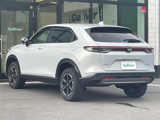 ホンダ ヴェゼル ハイブリッド e:HEV X 愛媛県 2022(令4)年 2.4万km プレミアムサンライトホワイトパール 純正ナビ（Bluetooth/HDD/フルセグテレビ）/追従クルーズコントロール/バックカメラ/前方ドライブレコーダー/パドルシフト/パーキングセンサー/ETC2.0/ABS/横滑り防止装置/前後コーナーセンサー/レーンキープアシスト/衝突被害軽減システム/ダウンヒルアシストコントロール/純正フロアマット/純正16インチアルミホイール/カーテンエアバック/置くだけ充電/USB入力端子/LEDヘッドライト/オートライト