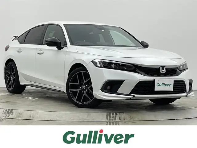 ホンダ シビック e:HEV 宮城県 2023(令5)年 2.4万km プラチナホワイトパール 純正コネクトナビ/リアスポイラー/LEDフォグライト/BOSEサウンド/アダプティブクルーズコントロール/トラフィックジャムアシスト/アダプティブドライビングビーム/BSM/パーキングセンサー/ホンダセンシング/前席パワーシート/シートヒーター/ワイヤレス充電器/コンビシート/ETC2.0/前後ドライブレコーダー/禁煙
