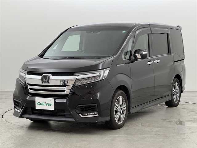 ホンダ ステップワゴン スパーダ eHEV G EXホンダS 福岡県 2020(令2)年 7.4万km プレミアムスパークルブラックパール ワンオーナー　/純正１１．６型後席モニター　/純正１０型ナビ　/バックカメラ　/ビルトインＥＴＣ２．０　/わくわくゲート　/前方ドラレコ　/アダプティブクルコン　/ホンダセンシング　/衝突軽減ブレーキ　/レーンキープ　/両側電動スライドドア　/ハーフレザーシート　/シートヒーター　/コンフォートビューパッケージ　/パフォーマンスダンパー