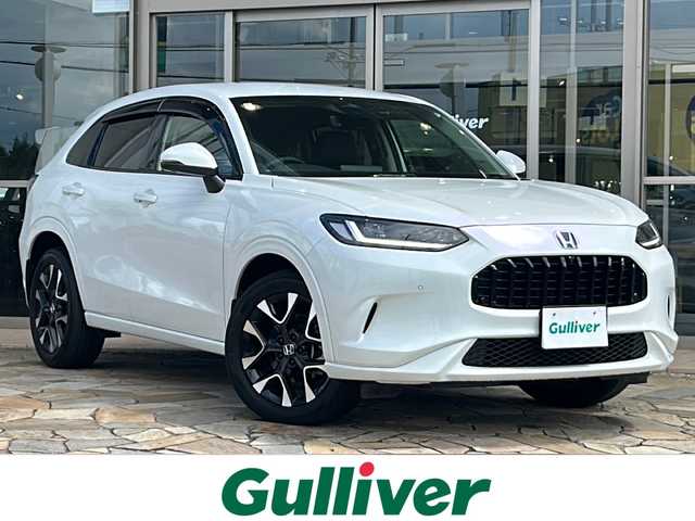 ホンダ ＺＲ－Ｖ ハイブリッド e:HEV Z 静岡県 2023(令5)年 1.9万km プラチナホワイトパール 純正ディスプレイオーディオ/・Bluetooth/・フルセグＴＶ/・ＵＳＢ/・スマホ連携/主要装備/・BOSEプレミアムサウンド/・衝突軽減/・レーンキープ/・追従クルコン/・コーナーセンサー前後/・全方位カメラ/・BSM/・パワーバックドア/・ワイヤレス充電/・ETC2.0/・レザーシート/・パワーシート/・シートヒーター/・ハンドルヒーター/・純正フロアマット/・純正アルミホイール