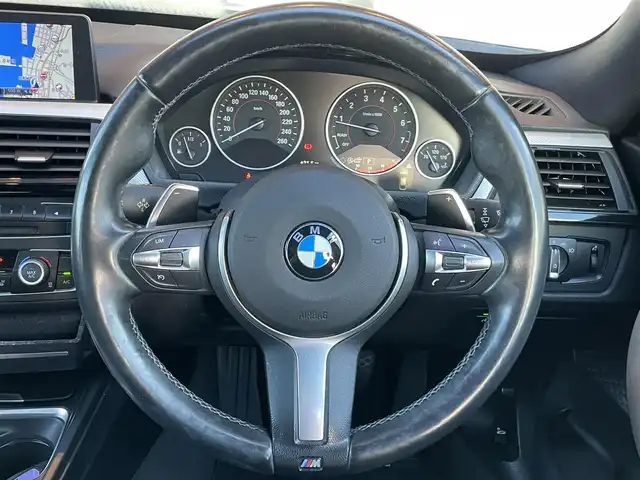 ＢＭＷ ３２０ｉ グランツーリスモ Mスポーツ 鹿児島県 2015(平27)年 8.2万km 白 禁煙車/純正ナビ/Bluetooth/CD/DVD/バックカメラ/ETC/USB入力端子/パワーシート/ドライブレコーダー/社外フロアマット/横滑り防止装置/レーンキープアシスト/オートライト/保証書/取扱説明書