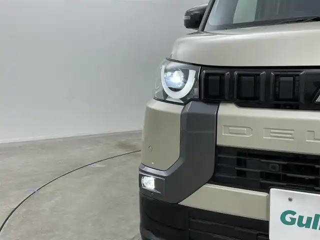 三菱 デリカミニ G プレミアム 岡山県 2024(令6)年 1.5万km ナチュラルアイボリーメタリック 純正9インチディスプレイオーディオ（AVIC-RQ720）/（Bluetooth/USB/Carplay/フルセグTV）/両側電動スライドドア/マイパイロット/デジタルインナーミラー/全方位カメラ/ステアリングヒーター/シートヒーター（運転席・助手席）/レーダークルーズコントロール/オートハイビーム/LEDヘッドライト/コーナーセンサー(前後)/ダウンヒルアシストコントロール/カーテンエアバック/社外フロアマット/純正15インチアルミ/ETC