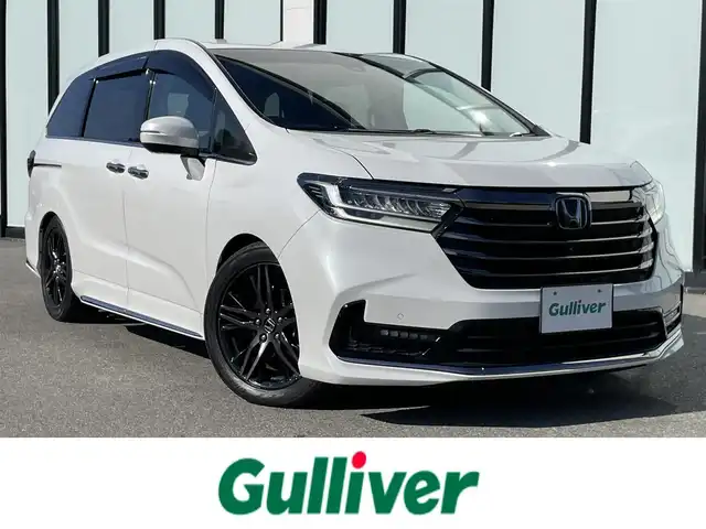 ホンダ オデッセイ アブソルート EX 大阪府 2021(令3)年 6.9万km プラチナホワイトパール 純正１０インチプレミアムインターナビ　/   フルセグＴＶ/CD/DVD/Bluetooth/USB　/全方位モニター　/純正１１．６インチ後席モニター　/ブラインドスポットモニター/クリアランスソナー/前席シートヒーター　/両側パワースライドドア　/レーダークルーズコントロール/レーンキープアシスト/アイドリングストップ　/電動リアゲート　/前席パワーシート/前後ドライブレコーダー/オットマン/純正18インチアルミホイール/エンジンスターター/純正フロアマット/プッシュスタート/スマートキー/ビルトインＥＴＣ２．０　/ＬＥＤ