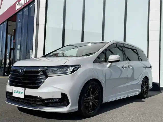 ホンダ オデッセイ アブソルート EX 大阪府 2021(令3)年 6.9万km プラチナホワイトパール 純正１０インチプレミアムインターナビ　/   フルセグＴＶ/CD/DVD/Bluetooth/USB　/全方位モニター　/純正１１．６インチ後席モニター　/ブラインドスポットモニター/クリアランスソナー/前席シートヒーター　/両側パワースライドドア　/レーダークルーズコントロール/レーンキープアシスト/アイドリングストップ　/電動リアゲート　/前席パワーシート/前後ドライブレコーダー/オットマン/純正18インチアルミホイール/エンジンスターター/純正フロアマット/プッシュスタート/スマートキー/ビルトインＥＴＣ２．０　/ＬＥＤ
