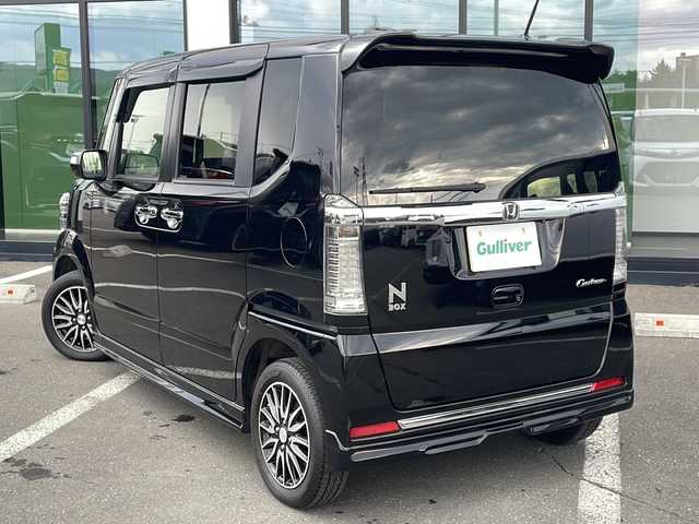 ホンダ Ｎ ＢＯＸ カスタム G ターボ Lパッケージ 道東・釧路十勝 2016(平28)年 5.4万km スマートブラック ・ターボ/・４WD/・純正ナビ/（CD・DVD・BT・TV・）/・バックカメラ/・クルーズコントロール/・パドルシフト/・両側パワースライドドア/・ビルトインETC/・純正エンジンスターター/・ハーフレザーシート/・ステアリングスイッチ/・シートヒーター/・ミラーヒーター/・オートライト/・オートエアコン/・オートリトラミラー/・プッシュスタート/・スマートキー/・無限エアロ/・モデューロAW/・純正フロアマット/・ドアバイザー/・ウィンカーミラー/・社外AW＆冬タイヤ積込/　155/65/14  2021年製　　5分山