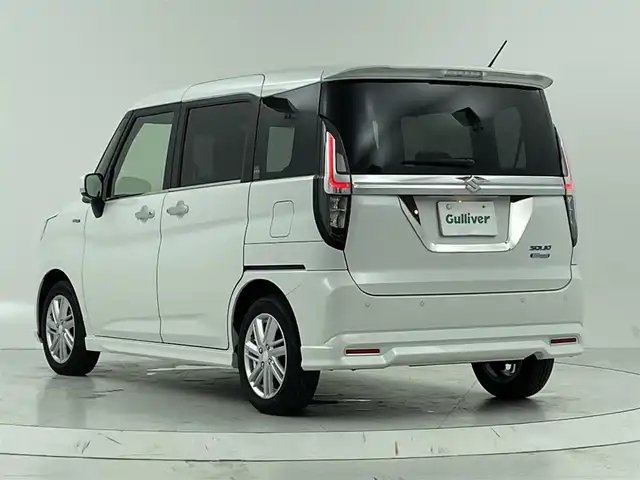 スズキ ソリオ HV MZ 大阪府 2023(令5)年 3.1万km ピュアホワイトP スズキセーフティサポート/　・衝突被害軽減ブレーキ/　・車線逸脱警報/　・道路標識認識機能/　・前後呉発進抑制機能/社外メモリナビ/　TV/FM/AM/Bluetooth/フルセグ/両側パワースライドドア/アダプティブクルーズコントロール/LEDヘッドライト(オートライト・フォグランプ)/シートヒーター（運転席・助手席）/純正１５インチアルミホイール/ヘッドアップディスプレイ/コーナーセンサー(後方)/アイドリングストップ/格納電動ウィンカーミラー/プッシュスタート/ETC/ドアバイザー/ビークルダイナミクスコントロール