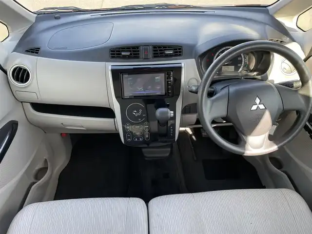 三菱 ｅＫワゴン M e－アシスト 岡山県 2015(平27)年 7.1万km チェリーブラウンパール 登録時走行距離：70806km/禁煙車/社外SDナビ(型番：CN-RS01WD)/　(CD/DVD/ワンセグTV/Bluetooth)/バックカメラ/衝突被害軽減システム/ETC/純正ハロゲンヘッドライト/ヘッドライトレベライザー/リモコンキー/アイドリングストップ/純正ホイールキャップ/ドアバイザー/電動格納ミラー/純正フロアマット/横滑防止装置/盗難防止装置/取扱説明書/新車時整備手帳（保証書）