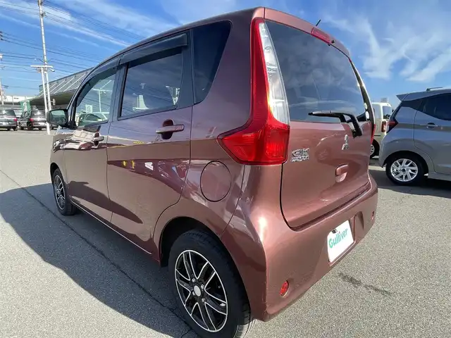 三菱 ｅＫワゴン M e－アシスト 岡山県 2015(平27)年 7.1万km チェリーブラウンパール 登録時走行距離：70806km/禁煙車/社外SDナビ(型番：CN-RS01WD)/　(CD/DVD/ワンセグTV/Bluetooth)/バックカメラ/衝突被害軽減システム/ETC/純正ハロゲンヘッドライト/ヘッドライトレベライザー/リモコンキー/アイドリングストップ/純正ホイールキャップ/ドアバイザー/電動格納ミラー/純正フロアマット/横滑防止装置/盗難防止装置/取扱説明書/新車時整備手帳（保証書）