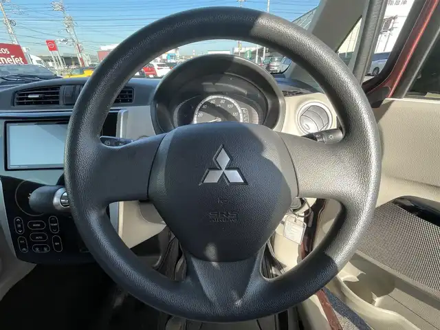 三菱 ｅＫワゴン M e－アシスト 岡山県 2015(平27)年 7.1万km チェリーブラウンパール 登録時走行距離：70806km/禁煙車/社外SDナビ(型番：CN-RS01WD)/　(CD/DVD/ワンセグTV/Bluetooth)/バックカメラ/衝突被害軽減システム/ETC/純正ハロゲンヘッドライト/ヘッドライトレベライザー/リモコンキー/アイドリングストップ/純正ホイールキャップ/ドアバイザー/電動格納ミラー/純正フロアマット/横滑防止装置/盗難防止装置/取扱説明書/新車時整備手帳（保証書）