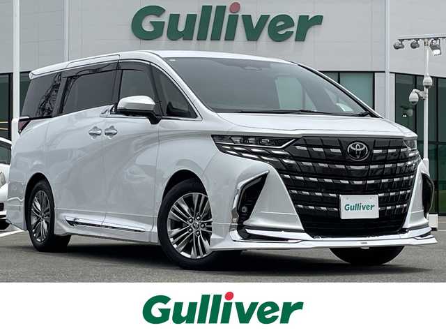 トヨタ アルファードハイブリット Z 佐賀県 2024(令6)年 0.9万km プラチナホワイトパールマイカ ワンオーナー/モデリスタエアロ【F/S/R】/左右独立ムーンルーフ/純正14型ディスプレイオーディオ/・HDMI/BT/AM/FM/フルセグTV/・Apple Car Play/Android Auto/パノラミックビューモニター/純正14型リヤシートエンターテインメントシステム/ビルトインETC2.0/純正前後ドライブレコーダー/黒革シート/・DN、セカンド席パワーシート/・DNセカンド席シートヒーター/ベンチレーション/・マイコンプリセットドライビングポジションシステム/・オットマン/革巻きステアリング【木目調】/・ステアリングヒーター/・パドルシフト/両側パワースライドドア/パワーバックドア/デジタルインナーミラー/カラーヘッドアップディスプレイ/後席用パワーサイドサンシェード/電動パーキングブレーキ/アクセサリーコンセント/置くだけ充電/純正18インチアルミホイール/3眼LEDヘッドランプ/アダプティブハイビームシステム/Toyota Safety Sence/・PCS/LTA/FCTA/・レーダークルーズコントロール/・パーキングサポートブレーキ/・ブラインドスポットモニター/・Advanced Park