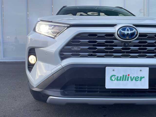 トヨタ ＲＡＶ４ ハイブリットG 神奈川県 2021(令3)年 6.1万km ホワイトパールクリスタルシャイン 純正１０．５インチコネクテッドナビ　AppleCarPlay/AndroidAuto/Bluetooth/フルセグテレビ　/電動リアゲート　/全周囲カメラ　/前後コーナーセンサー/前席シートヒーター　/運転席パワーシート　/クルーズコントロール　/オートマチックブレーキホールド　/ステアリングヒーター/ブラインドスポットモニター/プッシュスタート/前後ドライブレコーダー/ETC/LED/ドアバイザー/純正フロアマット/純正ホイール/衝突被害軽減システム