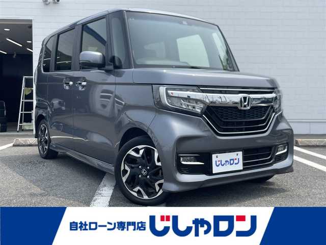 ホンダ Ｎ ＢＯＸ G L ターボ ホンダセンシング 熊本県 2018(平30)年 10.1万km シャイニンググレーM (株)IDOMが運営する【じしゃロン熊本店】の自社ローン専用車両になりますこちらは現金またはオートローンご利用時の価格です。自社ローンご希望の方は別途その旨お申付け下さい　/純正8インチSDナビ【VXU-207NBi】/　（フルセグTV・Bluetooth・DVD・AM/FM）/バックカメラ/前後ドライブレコーダー/ビルトインＥＴＣ/ステアリングスイッチ/クルーズコントロール/コーナーセンサー/衝突軽減ブレーキ/横滑り防止装置/レーンアシスト/オートライト/両側パワースライドドア/パドルシフト/電動格納ウィンカーミラー/ドアバイザー/ISOFIX/カーテンエアバック/純正フロアマット/純正LEDヘッドライト/純正15インチアルミホイール