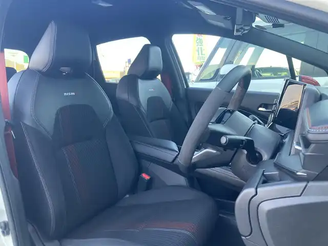 日産 オーラ ニスモ 香川県 2021(令3)年 2.9万km ピュアホワイトパール / スーパーブラック 2トーン 登録時走行距離：28951km/純正9型ナビ/　BT　フルセグTV/全方位カメラ/エマージェンシーブレーキ/レーダークルーズコントロール/レーンキープアシスト/クリアランスソナー/ブラインドスポットモニター/オートハイビーム/LEDヘッドライト/フォグランプ/リアフォグ/電子パーキングブレーキ/置くだけ充電/デジタルインナーミラー/ドライブレコーダー/ビルトインETC2.0/ハーフレザーシート/プッシュスタート/スマートキー