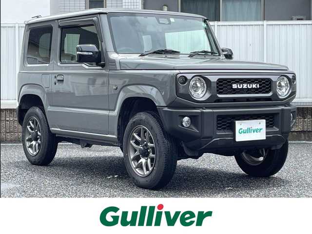 スズキ ジムニー XC 愛知県 2024(令6)年 0.5万km ミディアムグレー 4WD/ワンオーナー/アルパインナビ（9インチ）/AM/FM/SD/DVD/フルセグ/BT/HDMI/バックカメラ/衝突軽減/クルーズコントロール/オートハイビーム/レーンキープ/ダウンヒルアシストコントロール/ヒートシーター/スマートキー２/LED/フォグランプ/取説/保証書
