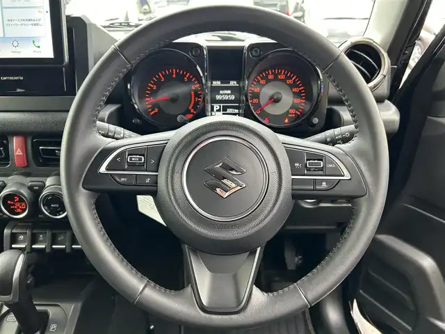 スズキ ジムニー ノマド FC 愛媛県 2025(令7)年 0.3万km 黒 登録時走行距離:2251km/社外オーディオ/AM/FM/Bluetooth/Apple car play/4WD/Bカメラ/追従クルコン/レーンキープアシスト/衝突軽減システム/横滑り防止装置/LEDヘッドライト/オートライト/エンジンスタートボタン/スマートキー/シートヒーター/純正アルミホイール/純正フロアマット
