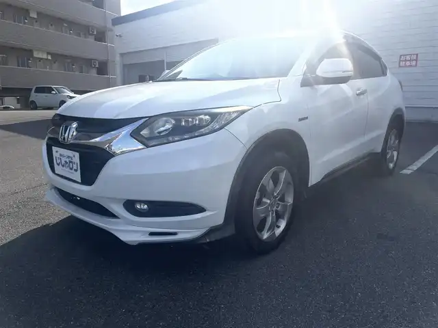 ホンダ ヴェゼル ハイブリッド X Lパッケージ 岡山県 2014(平26)年 11.3万km ホワイトオーキッドパール (株)IDOMが運営する【じしゃロン岡山店】の自社ローン専用車両になります。こちらは現金またはオートローンご利用時の価格です。自社ローンご希望の方は別途その旨お申付け下さい/純正8インチナビ/Bluetooth/バックカメラ/LEDヘッドライト/ハーフレザーシート/純正17インチAW/クルコン