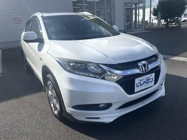 ホンダ ヴェゼル ハイブリッド X Lパッケージ 岡山県 2014(平26)年 11.3万km ホワイトオーキッドパール (株)IDOMが運営する【じしゃロン岡山店】の自社ローン専用車両になります。こちらは現金またはオートローンご利用時の価格です。自社ローンご希望の方は別途その旨お申付け下さい/純正8インチナビ/Bluetooth/バックカメラ/LEDヘッドライト/ハーフレザーシート/純正17インチAW/クルコン