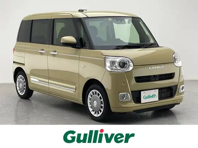 ダイハツ ムーヴ キャンバス セオリー G 兵庫県 2022(令4)年 2.9万km サンドベージュメタリック 純正メモリナビ/（CD/DVD/Bluetooth/フルセグTV/HDMI）/・NMZN-W73D/バックカメラ/横滑り防止装置/盗難防止装置/カーテンエアバッグ/コーナーセンサー（前後）/LKA/プリクラッシュセーフティー/両側パワースライドドア/シートヒーター（D/N席）/LEDヘッドライト/LEDフォグランプ/オートライト/オートマチックハイビーム/前方ドライブレコーダー/ETC/純正フロアマット/スマートキー/スペアキー1本/アイドリングストップ/ベンチシート