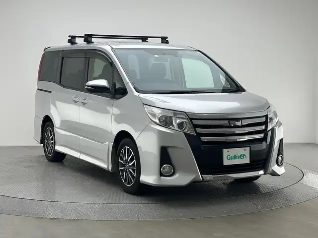 トヨタ ノア Si 兵庫県 2014(平26)年 7.4万km シルバーM 純正SDナビ/（NSZT-W62G）/フルセグ CD DVD BT MSV/両側パワースライドドア/バックカメラ/ETC/純正マット/ドアバイザー/アイドリングストップ/ルーフキャリア/LEDヘッドライト/オートライト/スマートキー/スペアキー