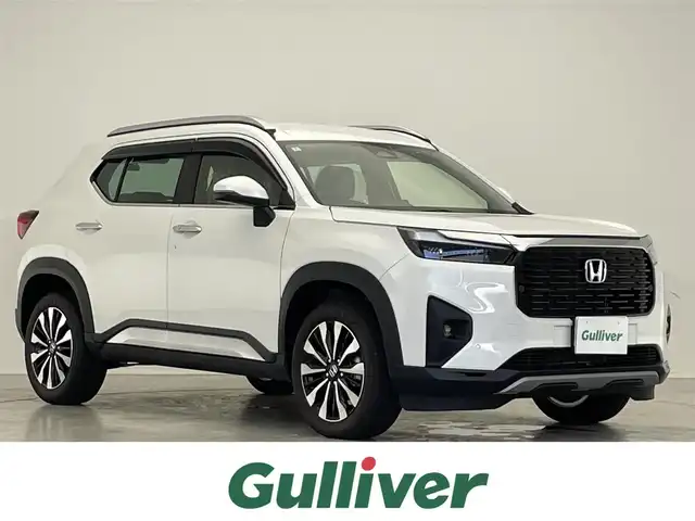 ホンダ ＷＲ－Ｖ Z+ 滋賀県 2024(令6)年 0.3万km プラチナホワイトパール 禁煙車/純正9型ナビ/（BT/フルセグTV/AppleCarplay）/ホンダセンシング/・衝突軽減ブレーキ（CMBS）/・先行車発進お知らせ機能/・歩行者事故低減ステアリング/・路外逸脱抑制機能/・標識認識機能/・アダプティブクルーズコントロール（ACC）/・車線維持支援システム（LKAS）/・誤発進抑制機能/・後方誤発進抑制機能/・近距離衝突軽減ブレーキ/・急アクセル抑制機能/・パーキングセンサーシステム/・オートハイビーム/バックカメラ/ETC/前後ドライブレコーダー/ハーフレザーシート/パドルシフト/ステアリングスイッチ/LEDヘッドライト/純正フロアマット/純正17インチAW