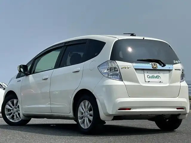 ホンダ フィット ハイブリット XHセレクション 島根県 2012(平24)年 2.4万km プレミアムホワイトパール 純正HDDナビ/CD/DVD/ワンセグTV/バックカメラ/クルーズコントロール/ステアリングスイッチ/パドルシフト/シートヒーター /ビルトインETC/スマートキー/スペアキー /純正フロアマット/ドアバイザー/純正アルミホイール/フロントワイパーデアイサー