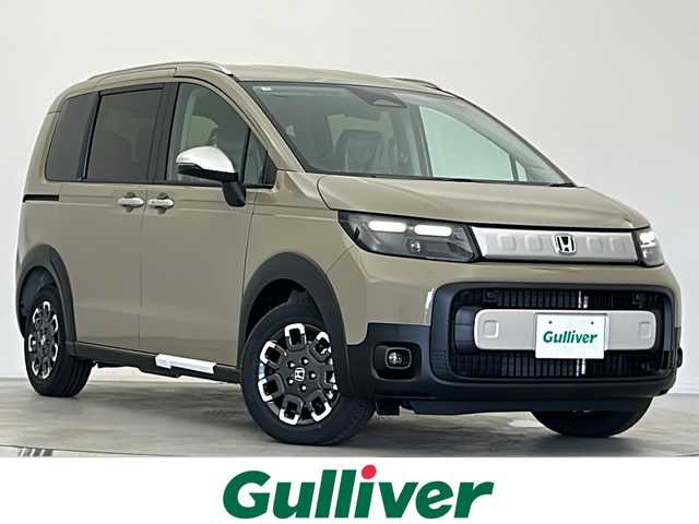 ホンダ フリード ハイブリット e:HEV クロスター 宮城県 2025(令7)年 0.1千km ベージュ 登録済未使用車　/純正９型ナビ　/アダプティブクルーズコントロール　/ＢＳＭ　/衝突軽減ブレーキ　/レーンキープアシスト　/オートハイビーム　/シートヒーター　/パーキングセンサー　/フロントウィンドウ熱線/バックモニター/Bluetoothオーディオ/フルセグTV/スマートフォン連携