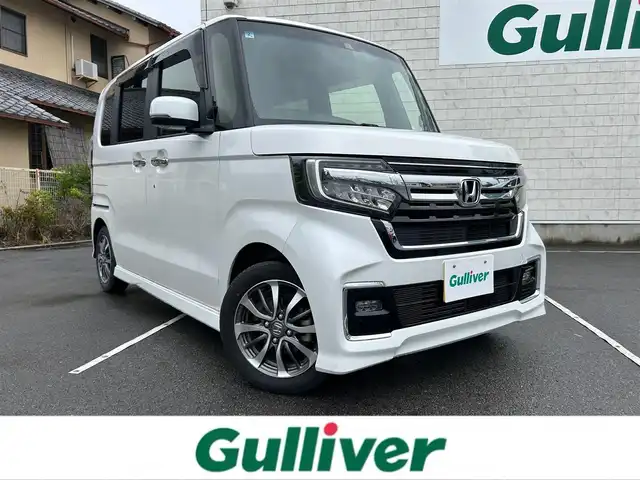 ホンダ Ｎ ＢＯＸ カスタム L 静岡県 2022(令4)年 1万km プラチナホワイトパール 社外メモリーナビ/（AM/FM/CD/DVD/BT）/フルセグTV/バックカメラ/社外ドライブレコーダー/スマートキー×2/プッシュスタート/左側パワースライドドア/レーダークルーズコントロール/シートヒーター/コーナーセンサー/フロアマット/ドアバイザー/衝突被害軽減ブレーキ/レーンキープアシスト/横滑り防止装置/保証書/取扱説明書