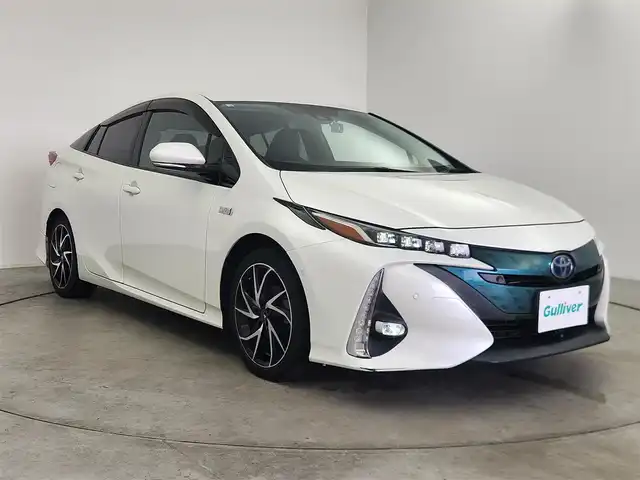 トヨタ プリウス ＰＨＶ A プレミアム 愛知県 2018(平30)年 8.2万km ホワイトパールクリスタルシャイン トヨタセーフティセンス/　　・プリクラッシュセーフティ/　　・レーンディバーチャーアラート/　　・レーントレーシングアシスト/　　・レーダークルーズコントロール/　　・オートマチックハイビーム/ブラインドスポットモニター/トヨタチームメイト/　　・アドバンストパーク/置くだけ充電/ヘッドアップディスプレイ/デジタルインナーミラー/純正11.6インチナビ/　　BT/フルセグ/バックカメラ/ドライブレコーダー/ビルトインETC/革巻きステアリング/ステアリングリモコン/ステアリングヒーター/本革シート/パワーシート（D席）/シートヒーター（前席）/純正LEDヘッドライト/フォグランプ/モデリスタ17インチアルミホイール