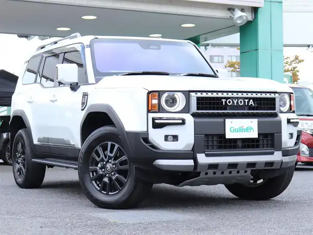 トヨタ ランドクルーザー ２５０ VX 神奈川県 2024(令6)年 0.9万km プラチナホワイトパールマイカ ワンオーナー/デジタルインナーミラー/トヨタチームメイト/：アドバンストドライブ/：緊急時操舵支援/：フロントクロストラフィックアラート/：レーンチェンジアシスト/丸目一眼LEDヘッドランプ/：角目一眼LEDヘッドランプ有り/ブラインドスポットモニター/モデリスタエアロ/シートヒーター/エアーシート/サンルーフ/ETC2.0/スペアタイヤ/スペアキー/トヨタ純正メモリナビ/フルセグテレビ/全周囲カメラ/ウィンカーミラー/クルーズコントロール(追従機能付)/ドアバイザー/プッシュスタート/保証書/取説/記録簿(R7)