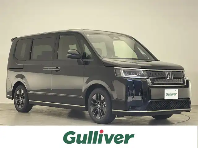 ホンダ ステップワゴン スパーダ eHEV 滋賀県 2025(令7)年 0.1万km未満 クリスタルブラックパール 禁煙車/純正11.4インチナビ/(DVD/SD/Bluetooth/フルセグ/AppleCarPlay/AndroidAuto)/前席シートヒーター/ブラインドスポットモニター/レーダークルーズコントロール/オートライト/オートハイビーム/ハーフレザーシート/LEDライト/バックカメラ/前後コーナーセンサー/電動リアゲート/両側パワースライドドア/ブレーキホールド/レーンキープアシスト/横滑り防止装置/プリクラッシュ/電子パーキング/スマートキー×2/プッシュスタート