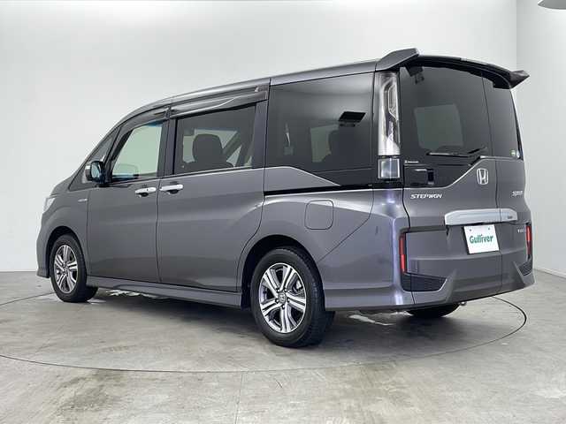 ホンダ ステップワゴン スパーダ ハイブリッド G ホンダセンシング 鹿児島県 2018(平30)年 6.7万km モダンスティールM 純正９インチナビ/（AM/FM/CD/DVD/Bluetooth）/衝突軽減ブレーキ　/レーダークルーズコントロール　/両側電動スライドドア　/ビルドインＥＴＣ　/ＬＥＤヘッドライト　/バックカメラ　/フルセグＴＶ　　/スペアキー　/スマートキー