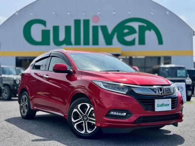 ホンダ ヴェゼル ハイブリッド Z ホンダセンシング 滋賀県 2018(平30)年 5.2万km プレミアムクリスタルレッドM ワンオーナー/純正フルセグナビ/　フルセグ Bluetooth CD DVD FM AM SD/バックカメラ/純正ドライブレコーダー/Honda SENSING/衝突軽減ブレーキ〈CMBS〉/誤発進抑制機能/歩行者事故低減ステアリング/路外逸脱抑制機能/ACC〈アダプティブ・クルーズ・コントロール〉/LKAS〈車線維持支援システム〉/先行車発進お知らせ機能/標識認識機能/コンフォートビューパッケージ/親水/ヒーテッドドアミラー/フロントドア撥水ガラス/熱線入りフロントウインドウ/純正LEDヘッドライト/純正LEDフォグランプ/純正17インチアルミ/運転席＆助手席シートヒーター/ルーフレール/コンビシート/スマートキー×2/プッシュスタート/